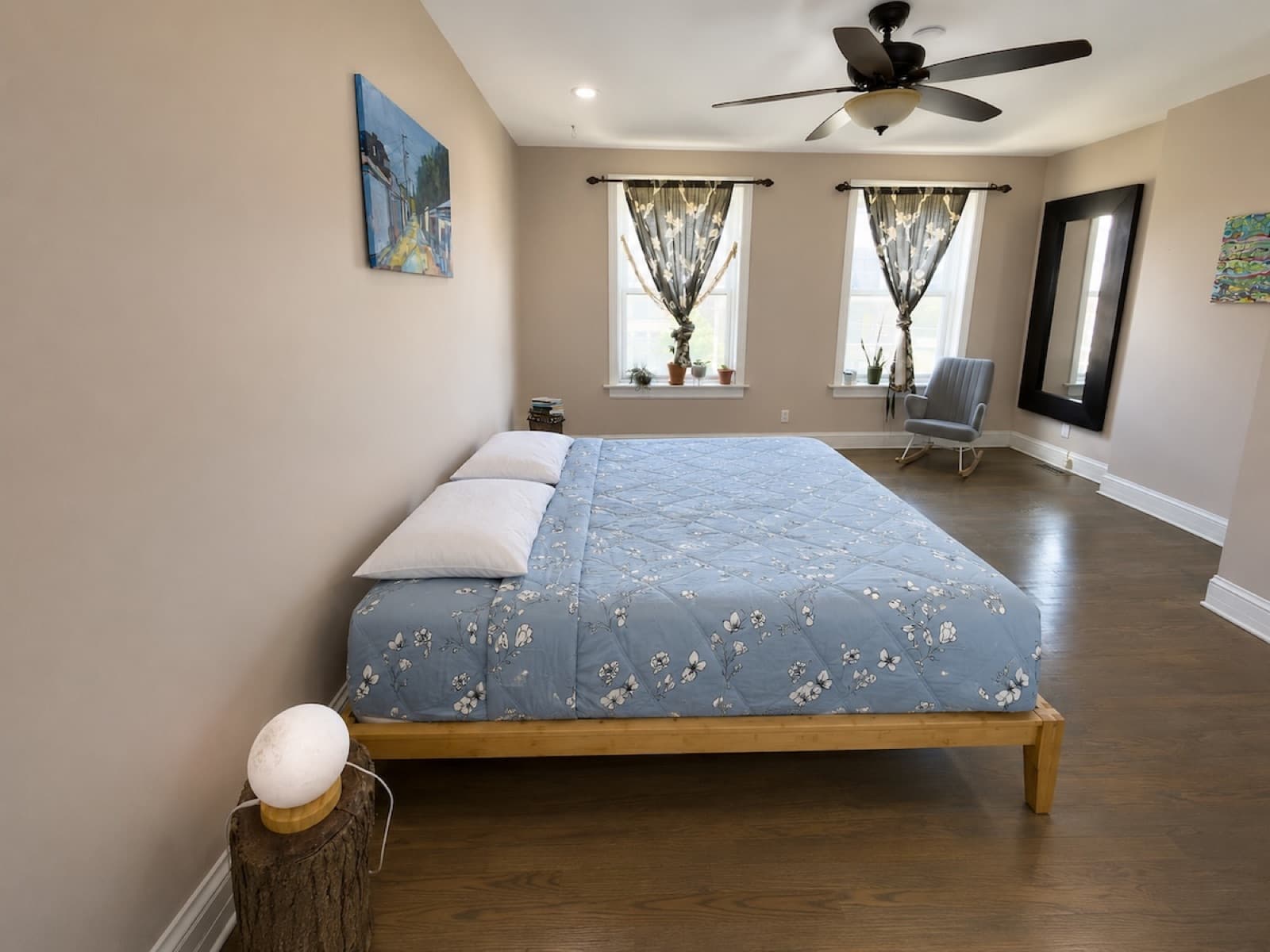 Bedroom with fresh paint, hardwood floors, and cleaned windows
